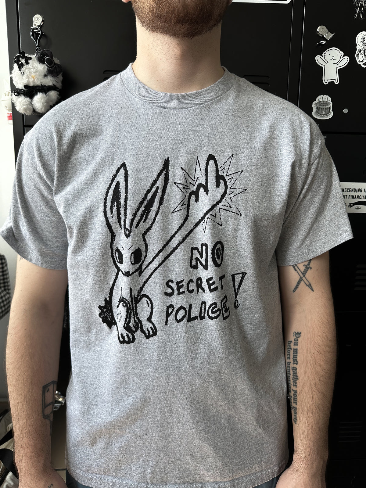 NO SECRET POLICE unisex tee *