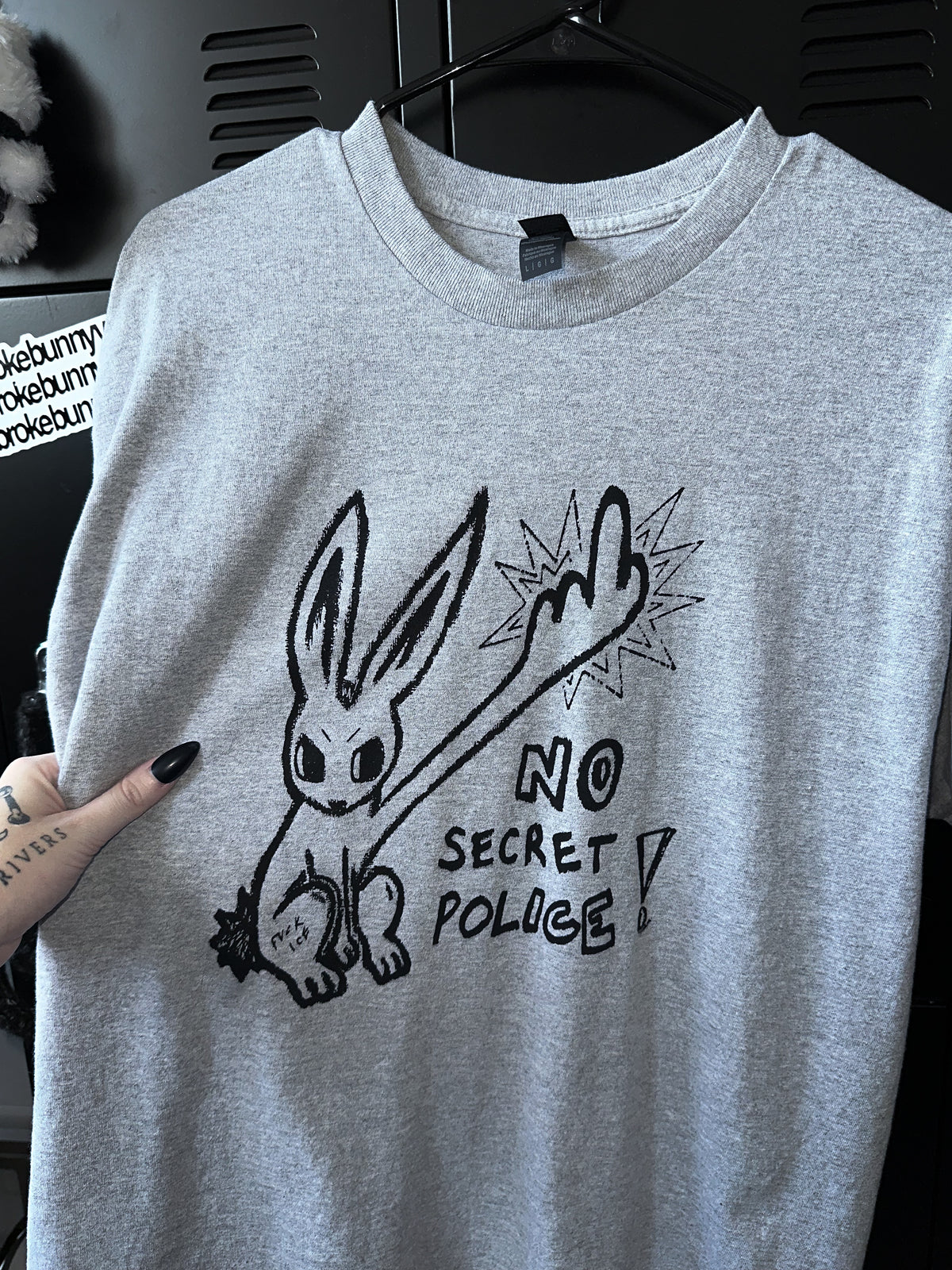 NO SECRET POLICE unisex tee *